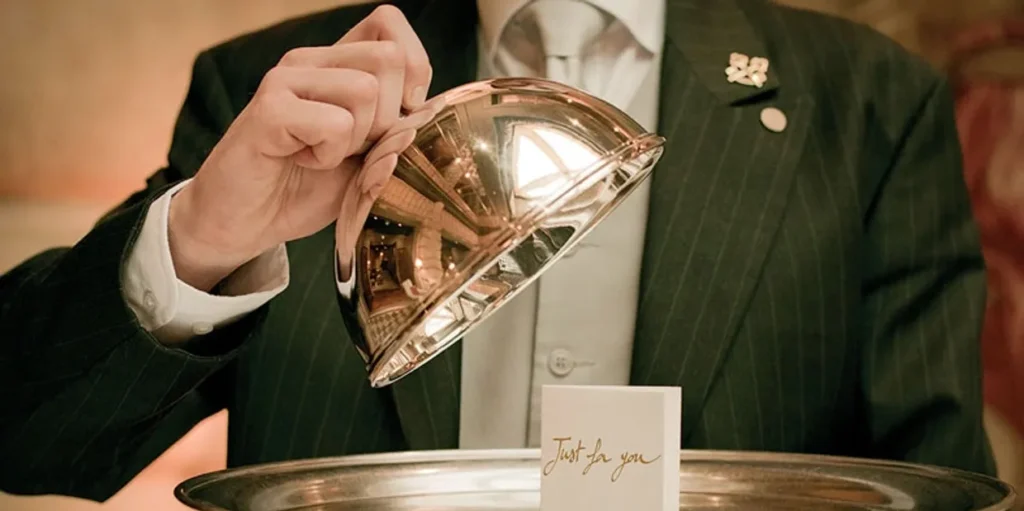 Professional hands holding luxury crystal diamond award trophy representing premium property management services